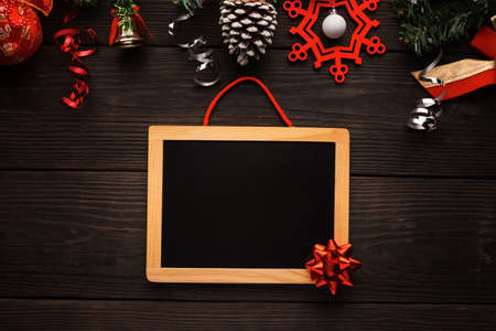 Background for Christmas greeting card or list of gifts for celebrating dark wooden background.の写真素材