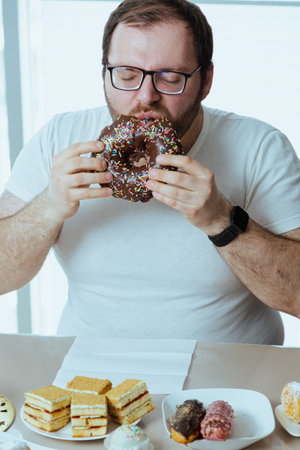 Health problems and extra weight problems because of eating fatty food, fat man with donuts.