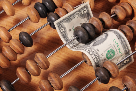 Two dollars in abacusの写真素材