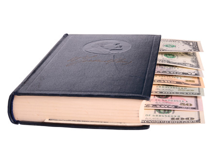 Dollars as a bookmark in tome of Vladimir Lenin