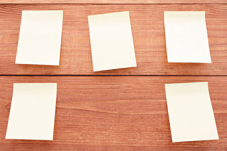 Five stickers on wood background