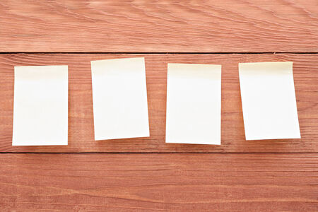 Four stickers on wood background
