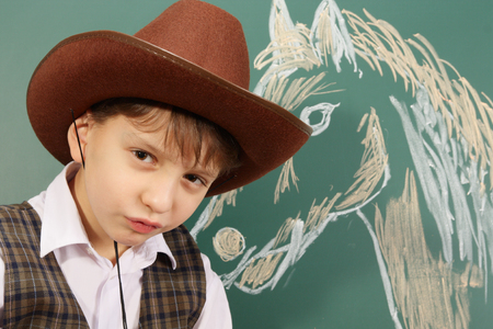 Happy artist as a cowboy and his horseの写真素材