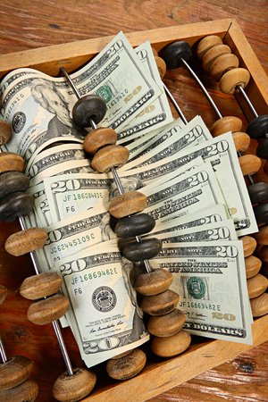 Abstract treasury concept. Dollars and abacusの写真素材