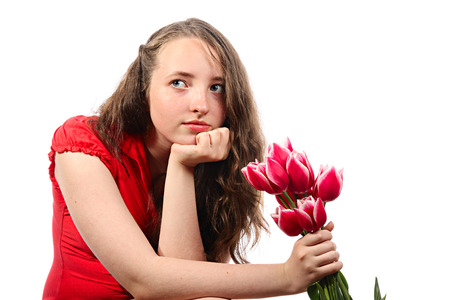The meditative girl with flowers. Isolated on whiteの写真素材