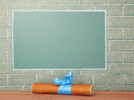 Classroom manuscript scroll under blackboard with copy spaceの写真素材