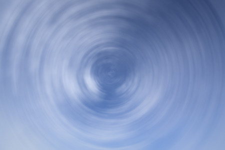 The abstract twirl blue blured backgroundの写真素材