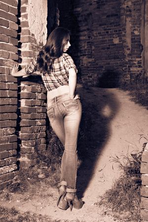 Attractive girl in ruins, split toningの写真素材