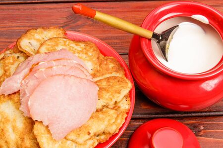 Belorussian traditional cuisine: potato pancakes with meat and sour creamの写真素材