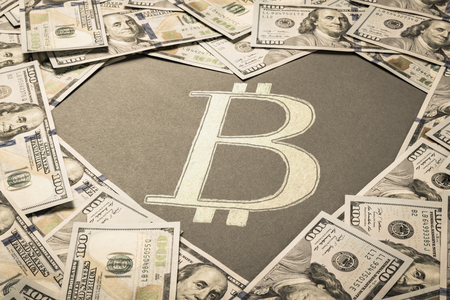 Heart shape and Bitcoin sign in center of dollar money backgroundの写真素材