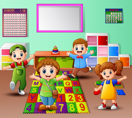 Happy kid playing in the kindergarten classroomの写真素材