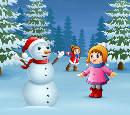 Happy kids playing with a snowman in winterのイラスト素材