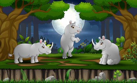 Cartoon three rhinos enjoying at night forestのイラスト素材