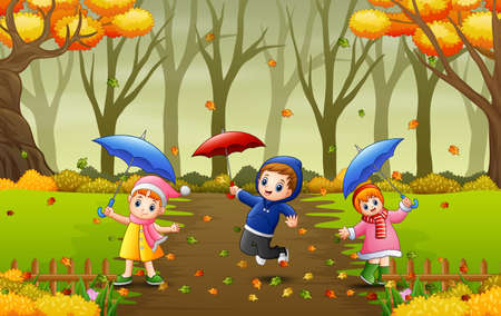 Cartoon kids holding umbrella in the autumnのイラスト素材