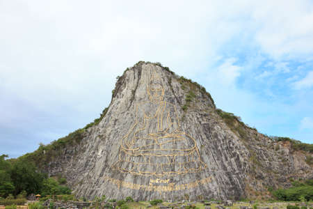 Buddha image is beautiful on cliff of the mountain in Thailand.の写真素材