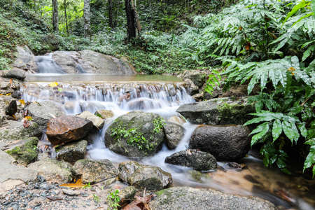 Water in stream is small waterfall that soft beautiful bubble.の写真素材