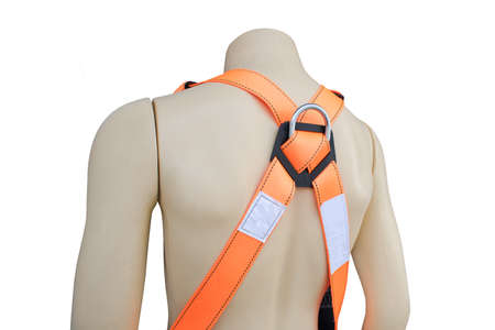 Mannequin wearing construction safety belt on isolated background.の写真素材