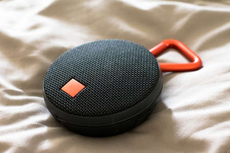 Round speaker on the bedの写真素材