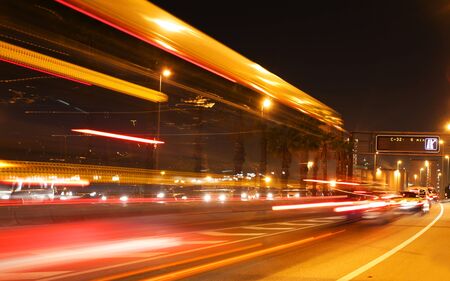rush of night time traffic on roadin  barcelona, spain