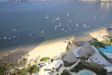 huge bay of hotels stretching along the coast in acapulco, mexicoのeditorial素材