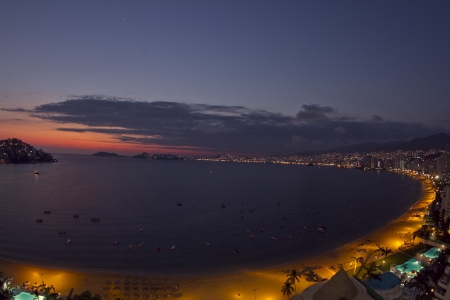 huge bay of hotels stretching along the coast in acapulco, mexicoのeditorial素材