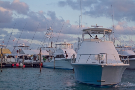 beautiful and dramatic shot with wonderful colours of yachts in a marina in isla mujeres, mexicoのeditorial素材