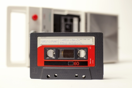 an old audio cassette in front of a retro tape playerのeditorial素材