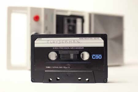 an old audio cassette in front of a retro tape playerのeditorial素材