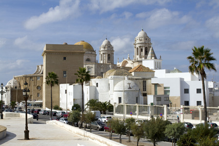 shot of the mixed styles of cadiz cathedral and surrounding streets, on a sunny dayのeditorial素材