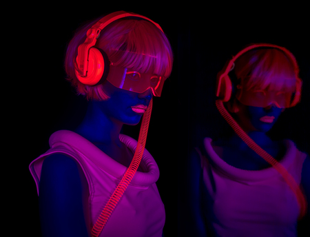 close up shot of sexy female disco dancer poses in UV costume
