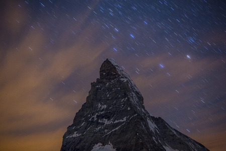 nighttime starry sky of the amazing matterhorn mountain in the Swiss Alps.の写真素材