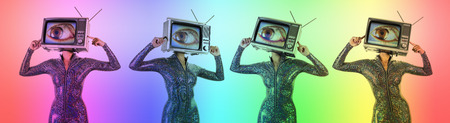 amazing woman dancing and posing with a television as a head. the tv has a large eye on itの写真素材