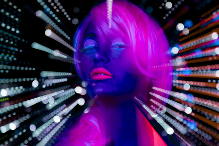 sexy cyber glow raver filmed in fluorescent clothing under UV black light.