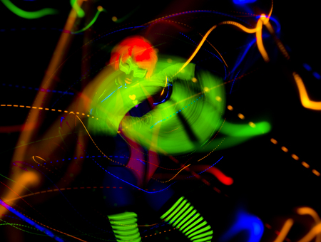sexy female disco dancer poses in UV fluorescent costumeの写真素材