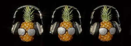 cool mr pineapple head with sparkling shades shades and headphonesの写真素材