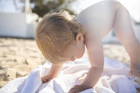beautiful baby girl on a beachの写真素材