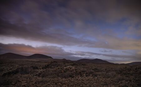 sunset clouds over mountains, Timanfaya National Park.の写真素材