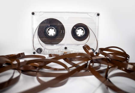 A clear cassette with magnetic tape on floorの写真素材