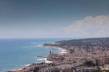 Coastline showing town of sitges, near Barcelona, Spainの写真素材
