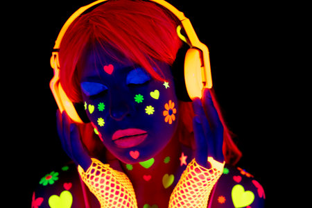 Female dancer in glow UV costumeの写真素材
