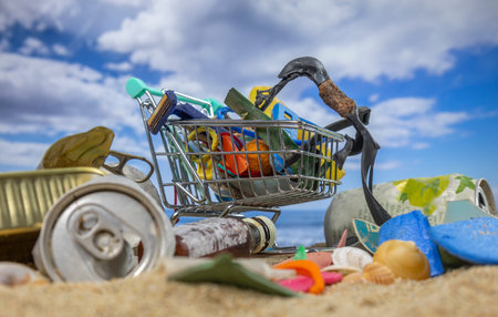 A trolley full of trash on beachの写真素材