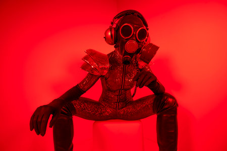 Female dancer psoing against red backgroundの写真素材