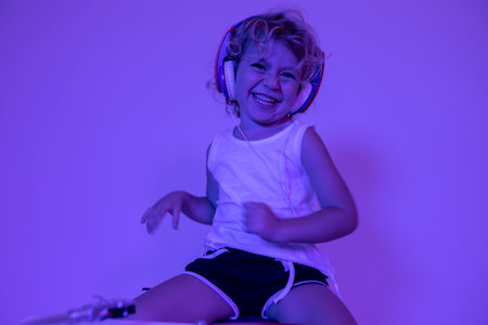 Small girl DJ with headphonesの写真素材