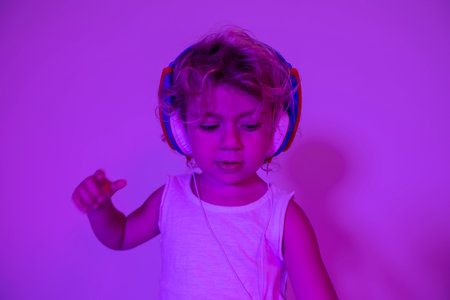 Small girl DJ with headphonesの写真素材