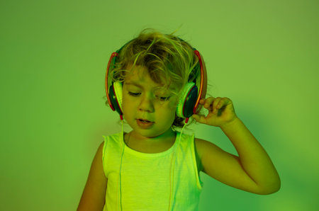 Small girl DJ with headphonesの写真素材