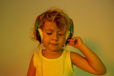 Small girl DJ with headphonesの写真素材