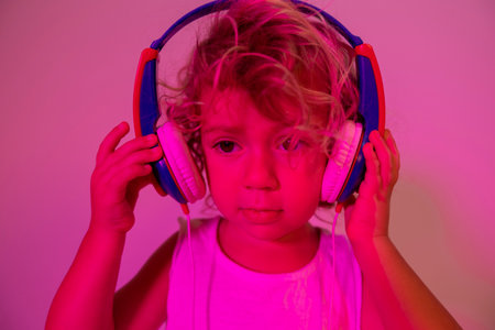 Small girl DJ with headphonesの写真素材