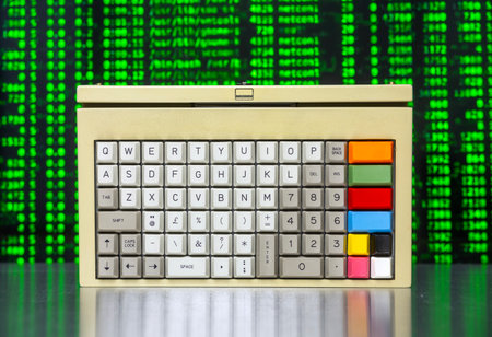 vintage computer keyboard with streaming data and codeの写真素材