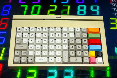 vintage computer keyboard with streaming data and codeの写真素材