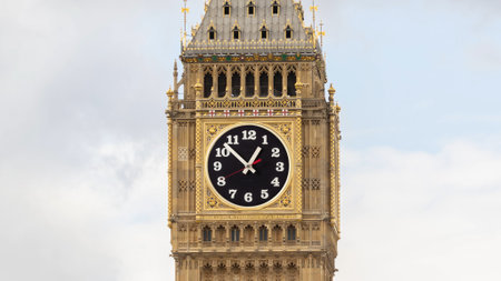 big ben in london, england with the clock face replaced with analogue clock